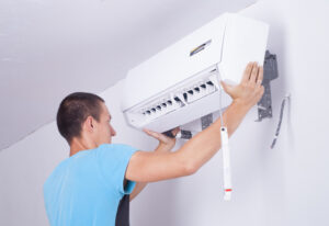 Man hanging AC unit