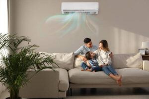 man and woman with child under AC unit