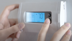 person adjusting temperature