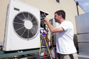 man servicing an A/C unit