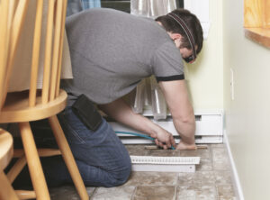 man performing duct work