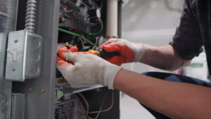 man repairing furnace
