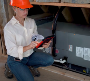 lady installing new furnace