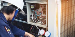 man providing maintenance on hvac machine