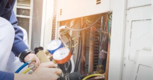 person measuring ac unit