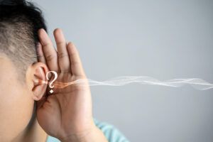 person with sound waves coming out of ear
