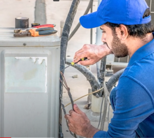 man fixing ac unit